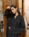 Luxury Black Open Abaya made from premium Zoom Nida fabric featuring elegant handcrafted floral handwork for modern modest fashion.