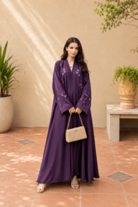The Amethyst Bloom Embroidered Abaya crafted from premium TikTok fabric featuring elegant DMC Nag embroidery work and an open front luxury modest design.